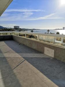 a balcony with a view of the ocean at Primera Linea de Playa Samil Costa con Garaje Incluido in Vigo