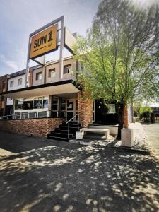 a building with a sign on the front of it at SUN1 BLOEMFONTEIN in Bloemfontein