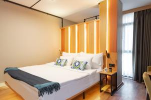a bedroom with a large white bed in a room at Antik Hotel Istanbul in Istanbul