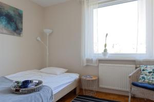Posteľ alebo postele v izbe v ubytovaní Apartament Dolina Poznań