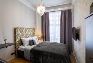 Un ou plusieurs lits dans un hébergement de l'établissement Chateau 9 Apartments by Prague Residences