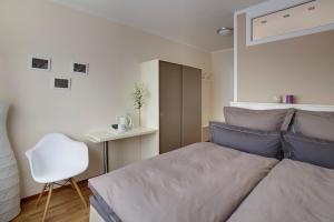 En eller flere senge i et værelse på Klein & Fein, Appartement- und Zimmervermietung