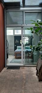 a sliding glass door leading to a patio with a bedroom at Waterfront Studio in Amsterdam