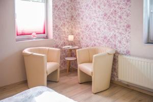 Posezení v ubytování Ferienwohnung am Zeulenrodaer Meer
