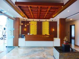 a lobby of a vanguard store with a counter at Ramee Wolkenburg Resort & Spa, Munnar in Munnar +107 photos