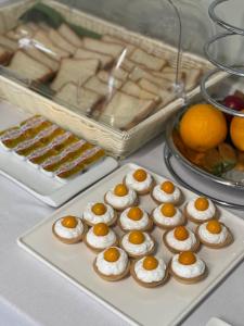 a tray of cupcakes with eggs on top on a table at Park Hotel in Dnipro