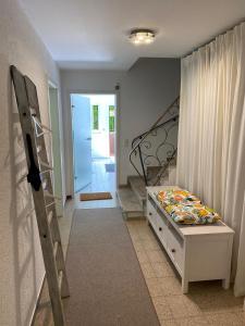a bedroom with a bed and a staircase in it at Ferienwohnung miraBelle in Erbach im Odenwald