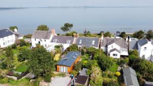 an aerial view of a small town with houses at Sunset Retreat Lodge with Hot Tub in Carsethorn