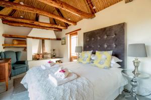 Ein Bett oder Betten in einem Zimmer der Unterkunft Swartberg Country Manor