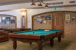 a billiard room with a pool table in it at Caucasus Hotel in Yerevan