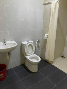 a bathroom with a toilet and a sink at Baojuwu 1 Bedroom Akademik Suites Austin Heights in Johor Bahru +21 photos