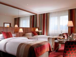 Voodi või voodid majutusasutuse Dublin Skylon Hotel toas