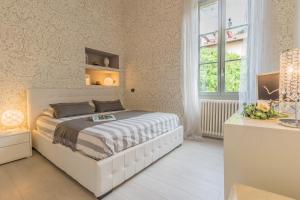 En eller flere senge i et værelse på Il Diamante del Lago + 42 billeder