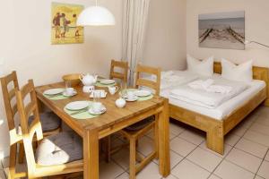 Giường trong phòng chung tại Pure Wonne Fanoe