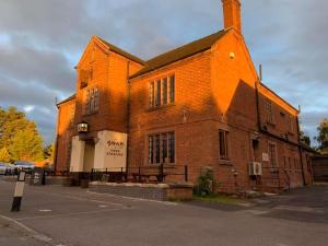 a large brick building with apertureperture at The Swan Hotel in Newport