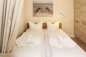 Giường trong phòng chung tại Pure Wonne Fanoe