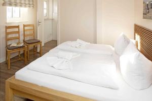 Giường trong phòng chung tại Pure Wonne Fanoe +9 ảnh