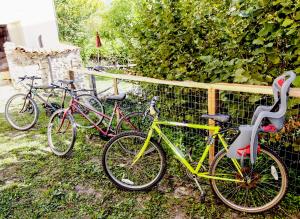 a group of bikes parked next to a fence at Casa Vacanze Antico Poggio in Poggio San Giovanni