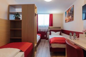 Ένα ή περισσότερα κρεβάτια σε δωμάτιο στο Hotel Hamburger Perle