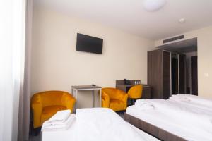 Łóżko lub łóżka w pokoju w obiekcie Lifestyle Hotel Leithana