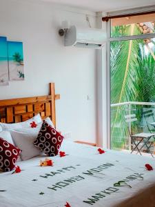 Voodi või voodid majutusasutuse Shallow Lagoon Rasdhoo toas