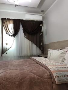 Katil atau katil-katil dalam bilik di Apartamento Marquinho