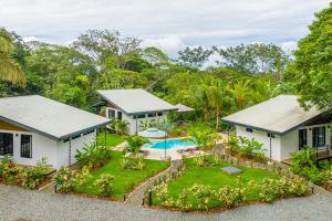 an aerial view of a house with a swimming pool at The Sutton - Boutique Jungle Experience in Uvita