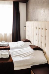 Кровать или кровати в номере Verhovel Hotel