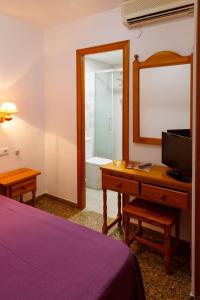 Postel nebo postele na pokoji v ubytování Hotel Herasu