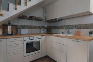 Kuchyň nebo kuchyňský kout v ubytování Studio Apartman Bohem