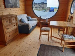 a room with a bed and a table and a mirror at Penystryd in Trawsfynydd