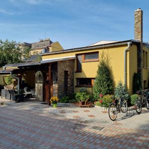 a house with two bikes parked outside of it at Apartmány 235 - 3 in Jaroměř