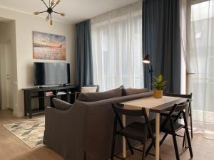 a living room with a couch and a table at Zane's apartment in Valmiera
