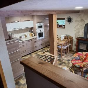 a kitchen with a table and a dining room at Apartmány 235 - 3 in Jaroměř