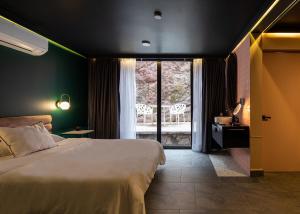 Postel nebo postele na pokoji v ubytování Casa Nada Hotel