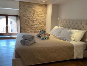 Posteľ alebo postele v izbe v ubytovaní Assisi AD Apartments - Fratello Sole Luxury Loft