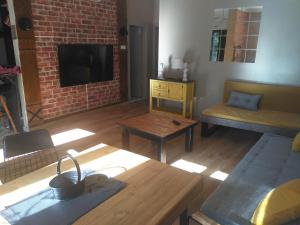 a living room with a couch and a table at Happy Accomation Houses 192mt to Harbour no6 in Marmaris