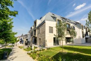 an apartment building with a gray roof at New with a View - Spectacular Views in Every Direction in Hévíz