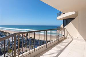 a balcony with a view of the beach at Allunga Stunning Beach Side Apartment in Gold Coast