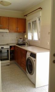 A kitchen or kitchenette at Maria's Little apartment