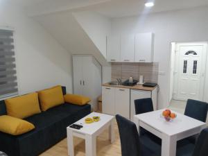 a living room with a couch and a table at Vila Leolaz in Višegrad