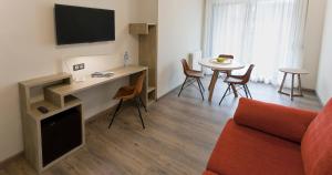 TV a/nebo společenská místnost v ubytování Hotel Dos Rios Central