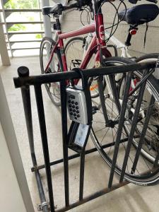 a bike chained to a fence with a parking meter at Dida in Saint-Sauveur-des-Monts