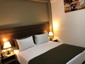 Postel nebo postele na pokoji v ubytování ikala Santa Cruz