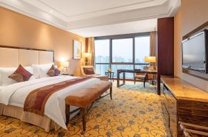 Postel nebo postele na pokoji v ubytování Shenzhen L.gem Hotel + 35 fotografií