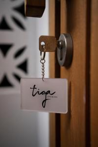 a tag on a door with the word fire on it at Tiga Studios - Adults Only in Kuta Lombok