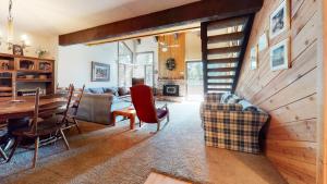 a living room with a couch and a table at Wild Flower 42 Apartment in Mammoth Lakes