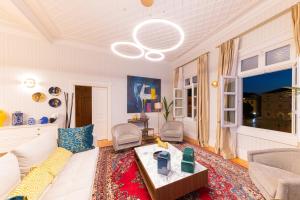 a living room with a couch and a table at Castellano Hotel & Suites in Nafplio