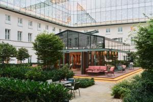 a view of a building with chairs and tables at Raffles Europejski Warsaw in Warsaw