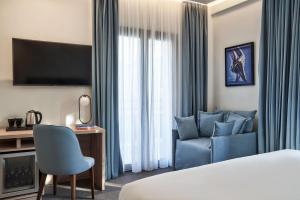 A bed or beds in a room at NLH KERAMEIKOS - Neighborhood Lifestyle Hotels